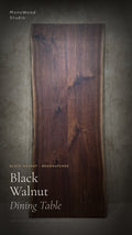Walnut dining table with bookmatched wood grain, rectangular tabletop.