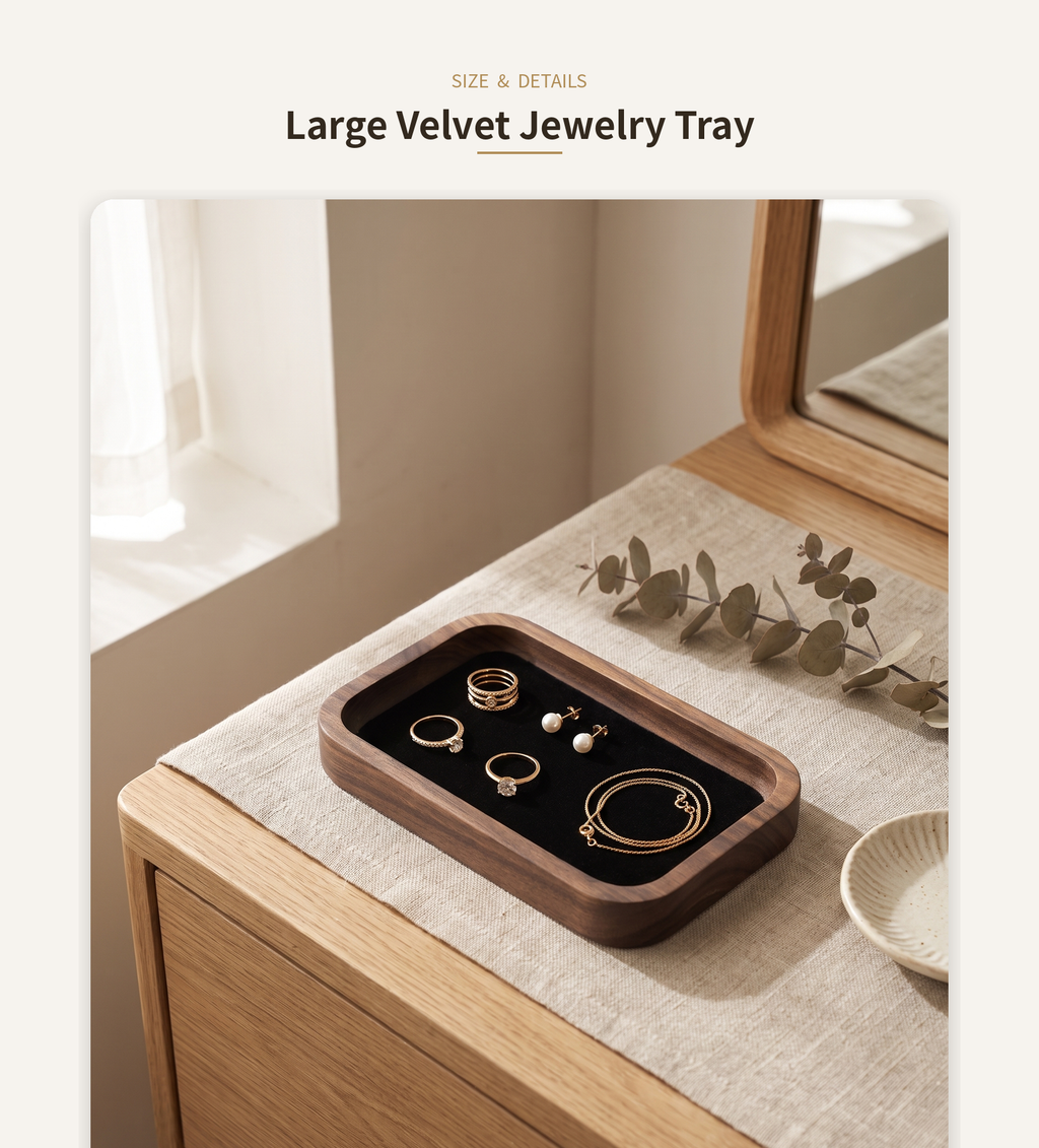 Walnut rectangle jewelry tray with black velvet insert and scattered earrings on top