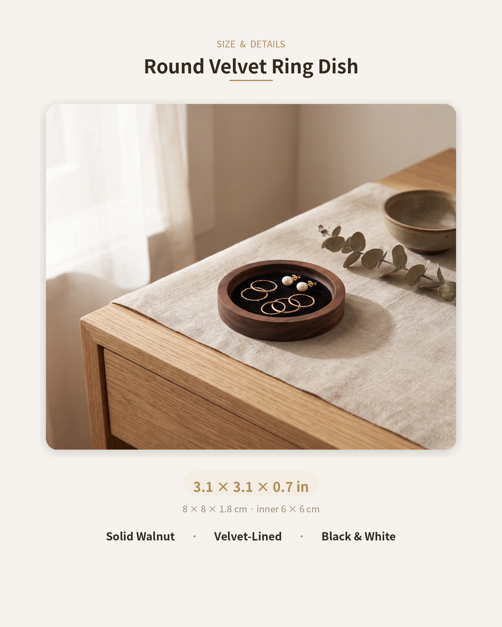 Small round velvet ring dish on a wooden surface, shown with jewelry