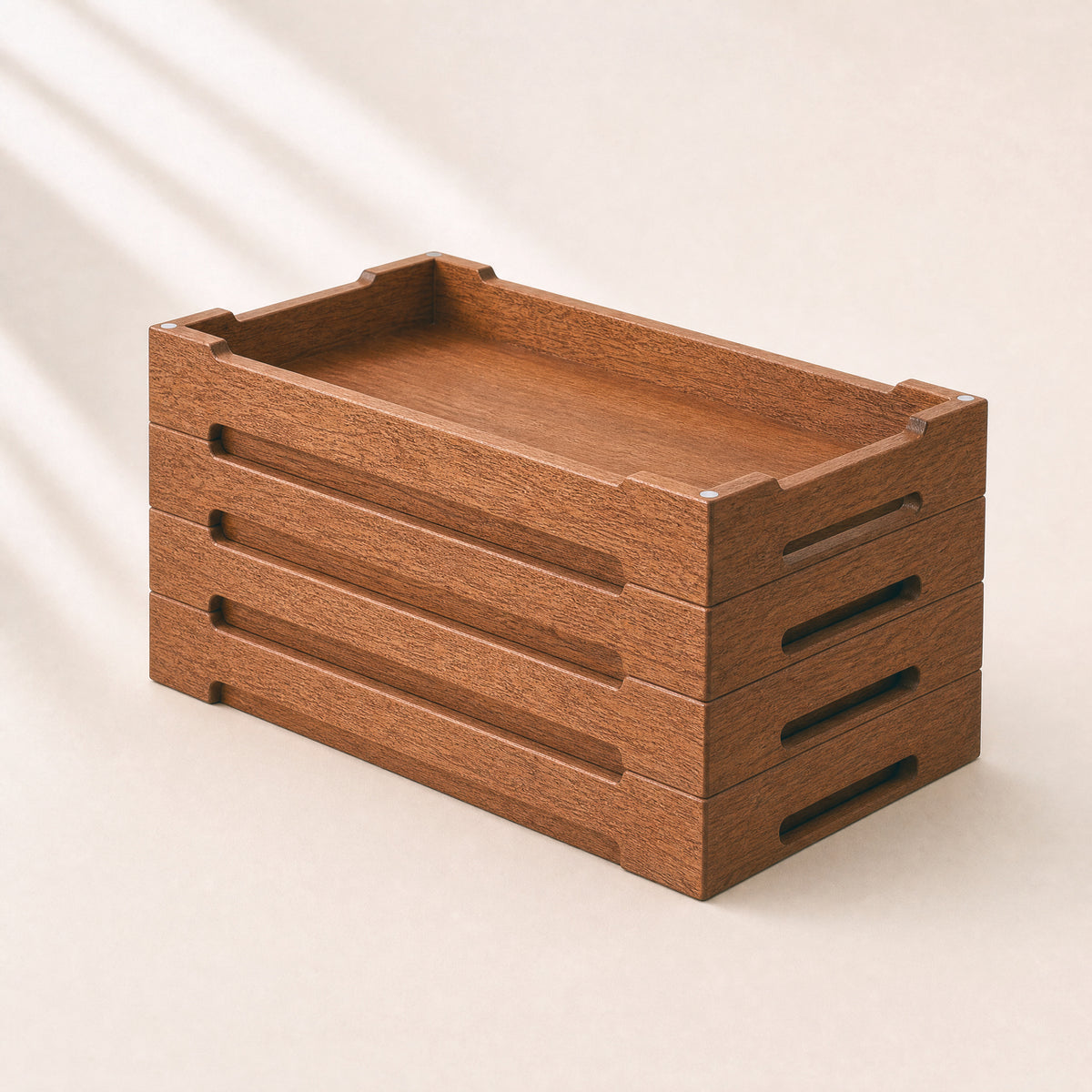 Stackable wooden cable box with open top and side cable slots, no device shown