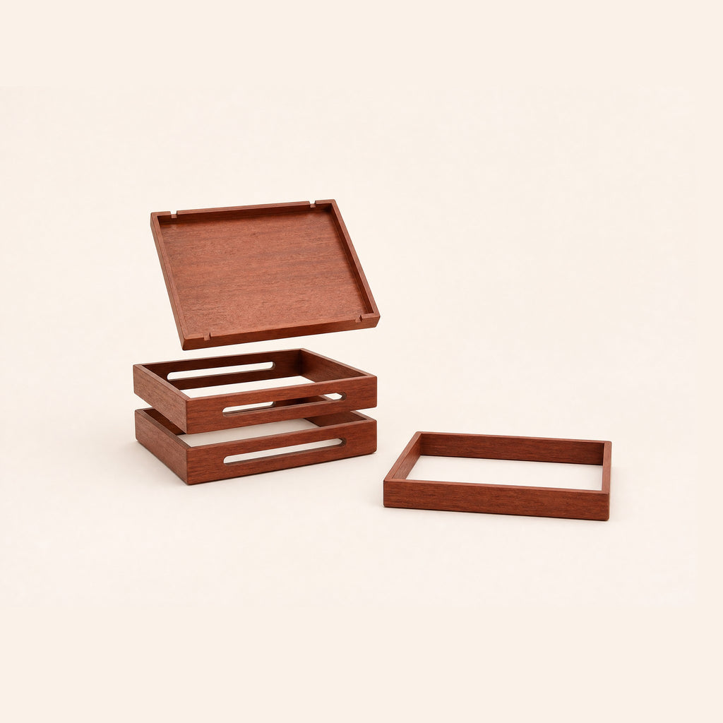 The four pieces apart: one solid tray and three open frames with cable slots