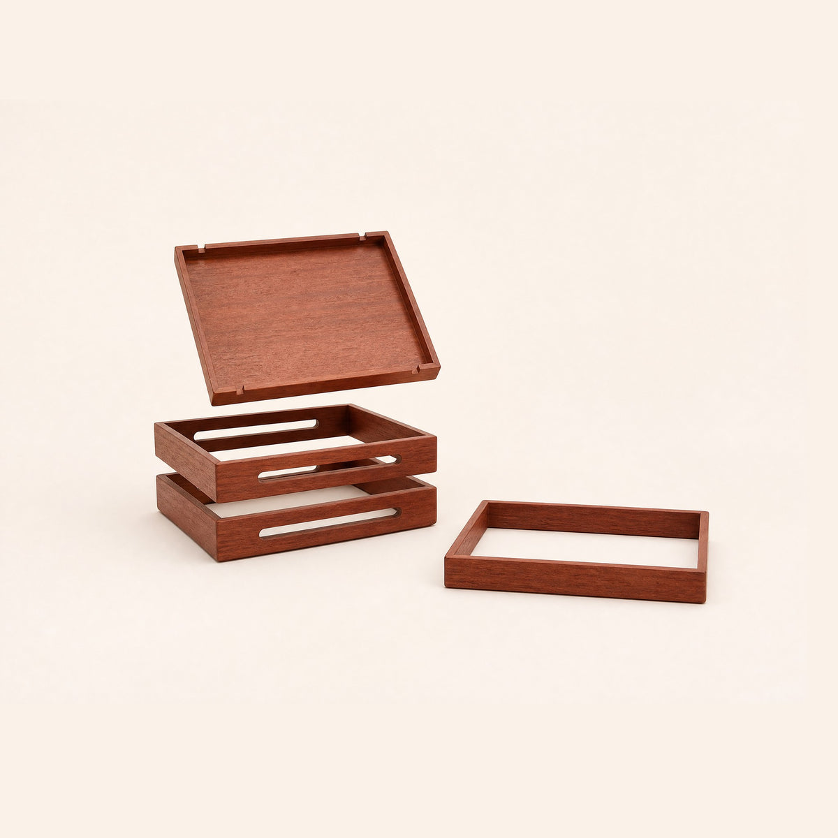 The four pieces apart: one solid tray and three open frames with cable slots