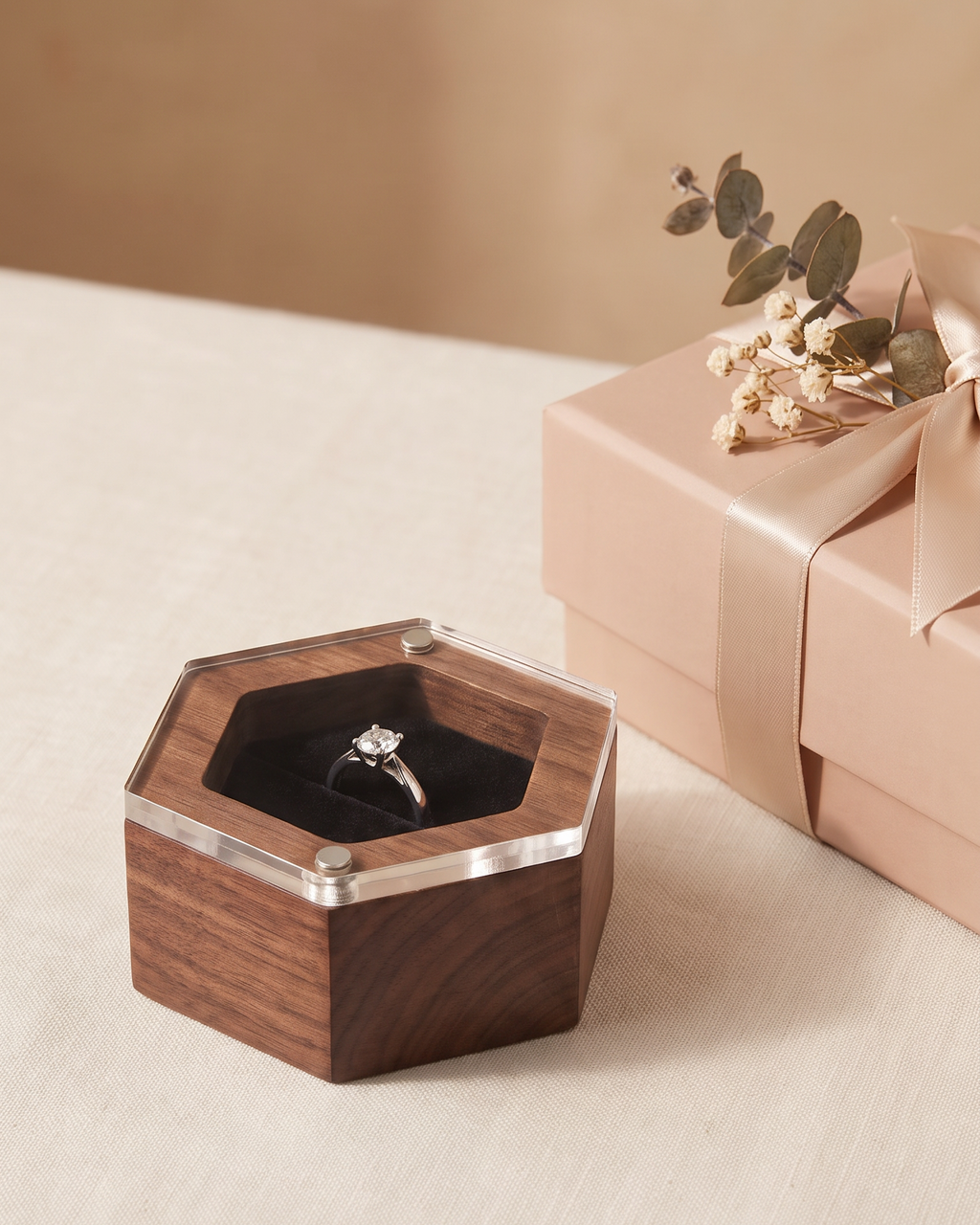Walnut hexagon ring box with clear lid, black velvet ring insert, and metal corner details