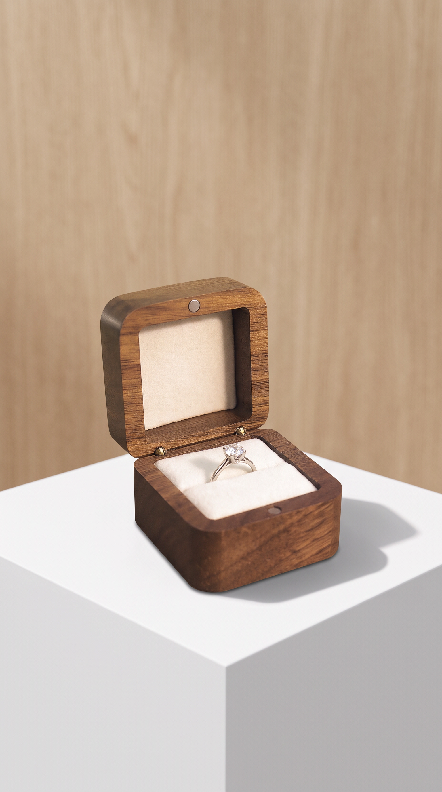 Walnut wood ring box with open lid and white velvet insert, empty slot