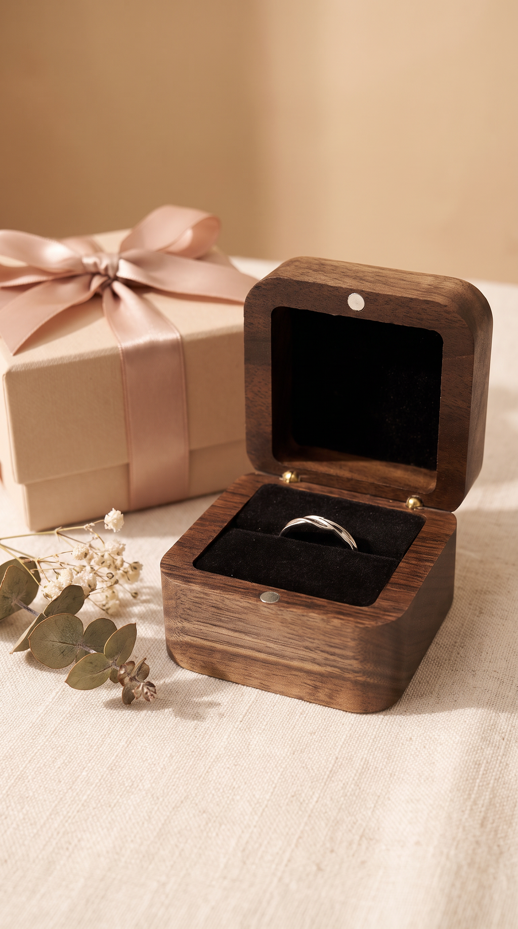 Walnut ring box open with black velvet ring cushion and magnetic flip-top lid