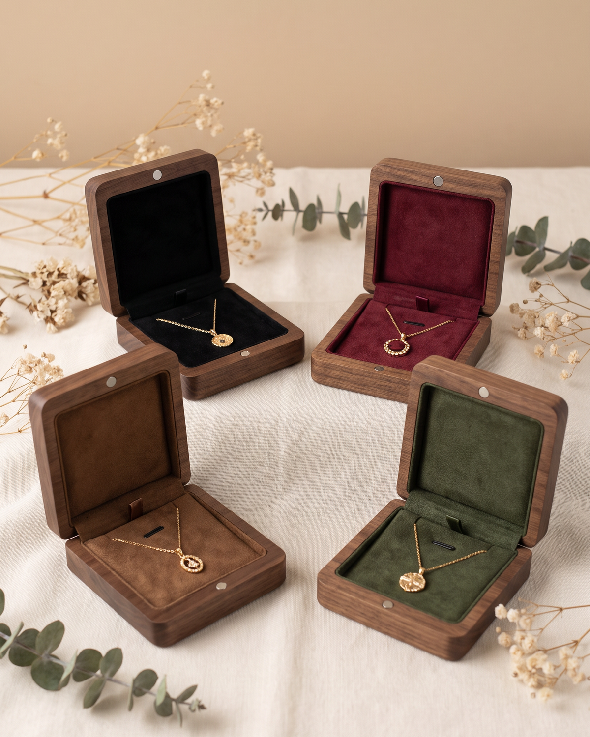 Assorted walnut necklace boxes with open lids, velvet inserts in multiple colors