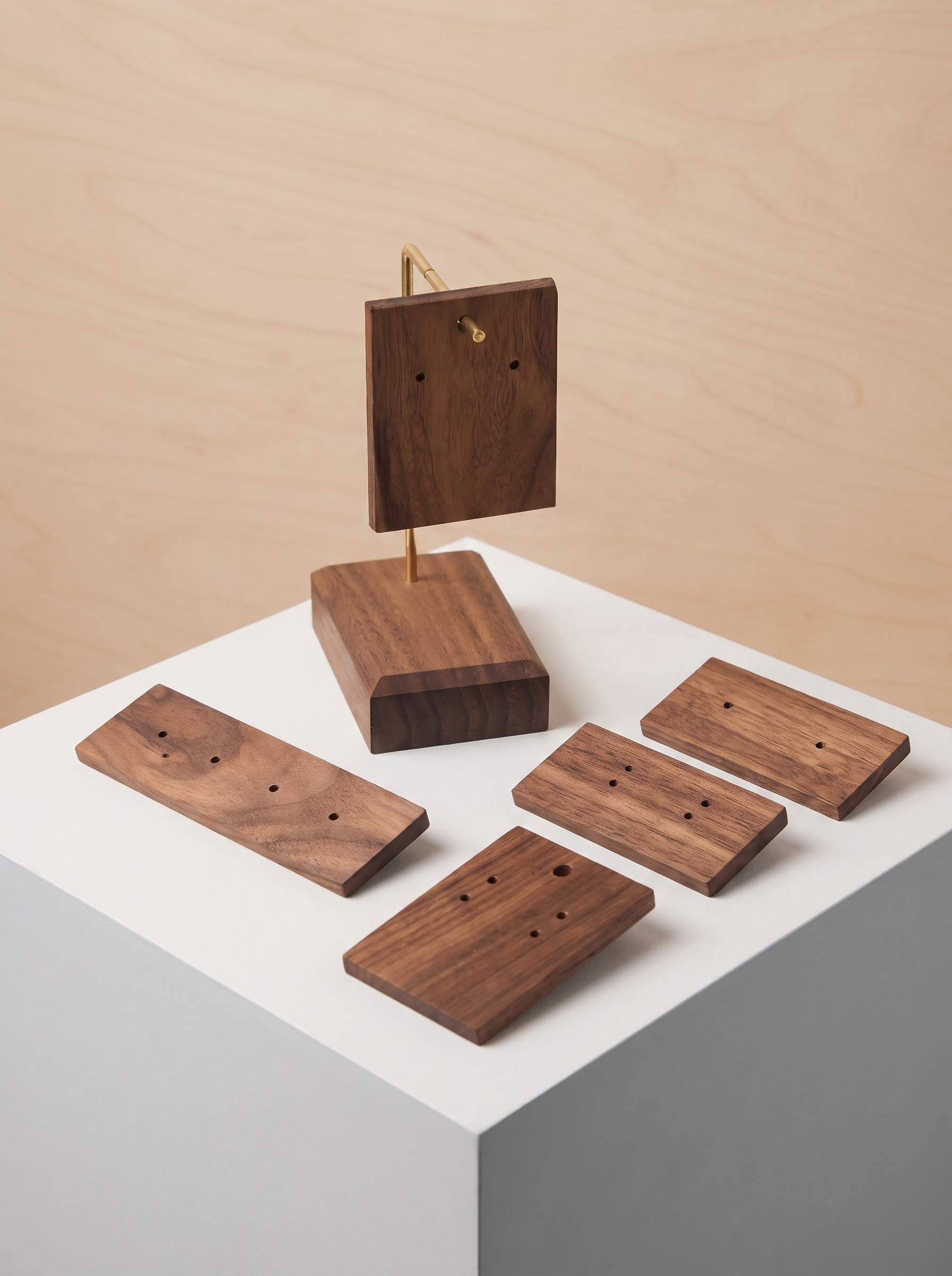 Walnut earring holder stand with stacked boards and matching dark wood earring inserts