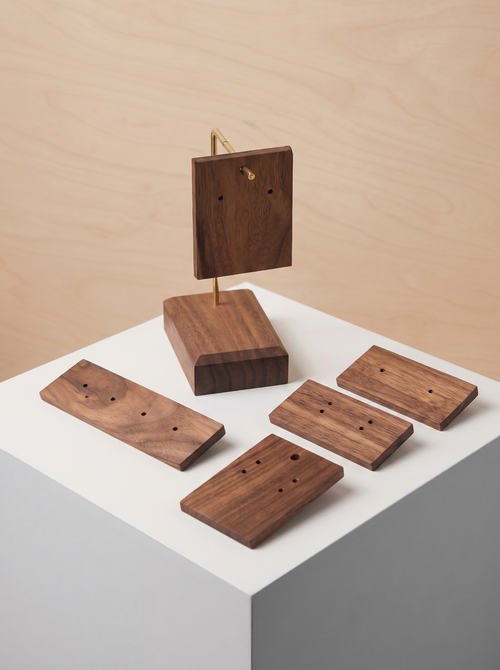 Walnut earring holder stand with stacked boards and matching dark wood earring inserts