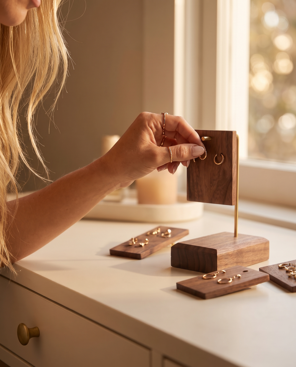 Walnut earring holder stand with earrings arranged on small wooden bases