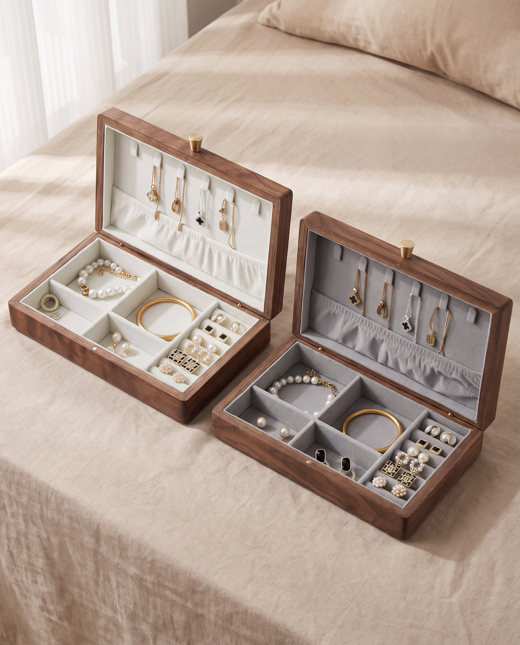 Walnut jewelry box set opened to show white and gray velvet compartments for jewelry.