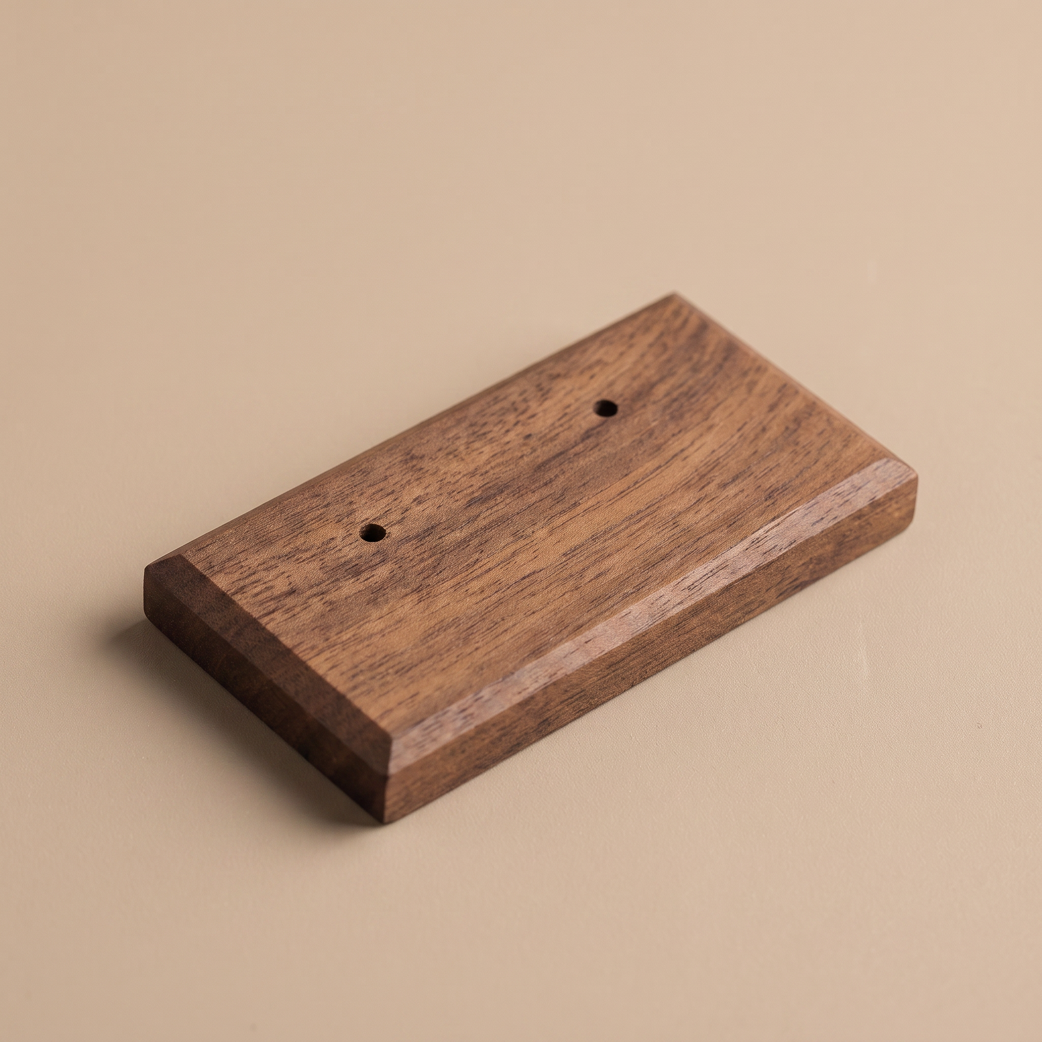 Walnut earring display board with two drilled holes on top surface