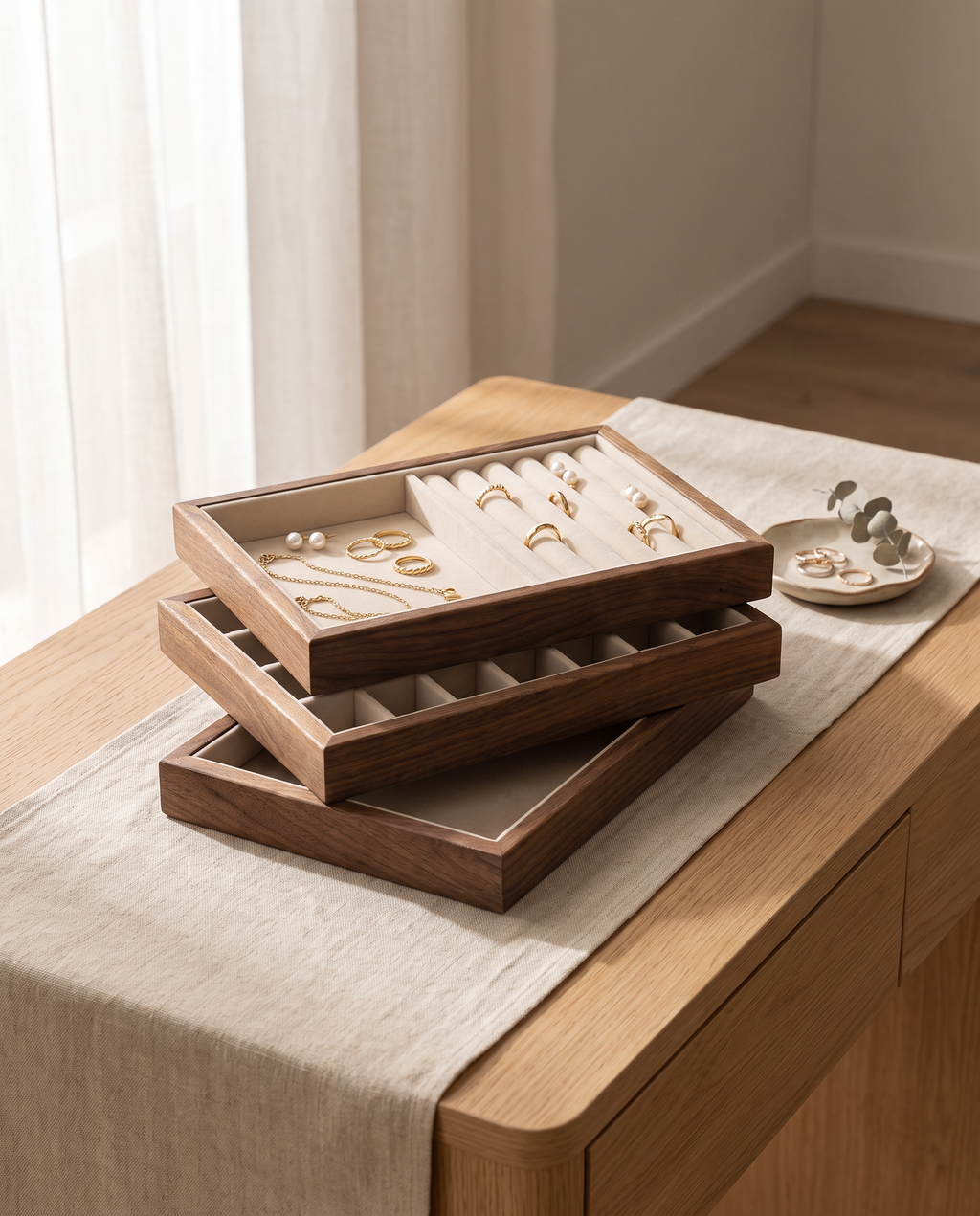 Stackable walnut jewelry tray with velvet sections, rings and bracelets inside
