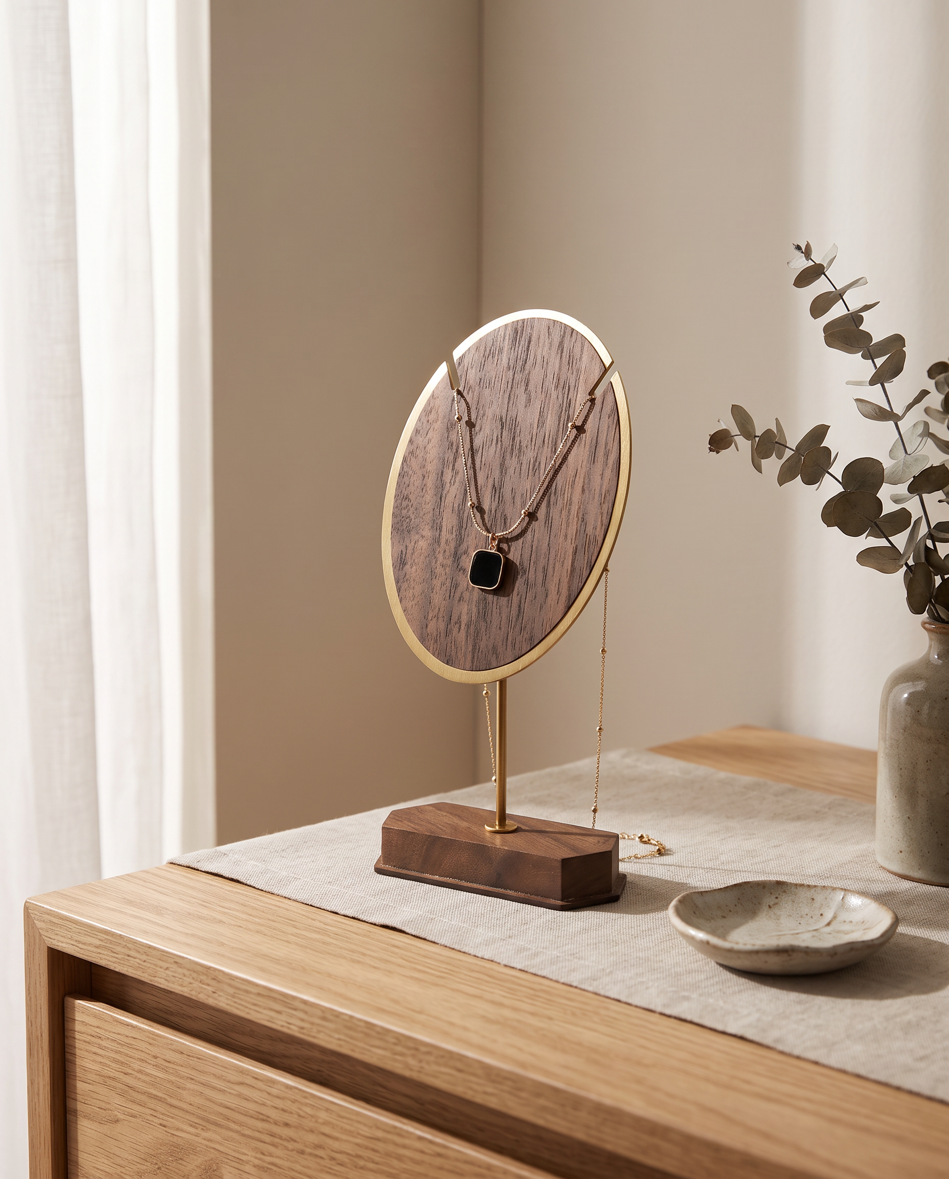 Walnut oval necklace display stand with gold rim and hanging necklace on base