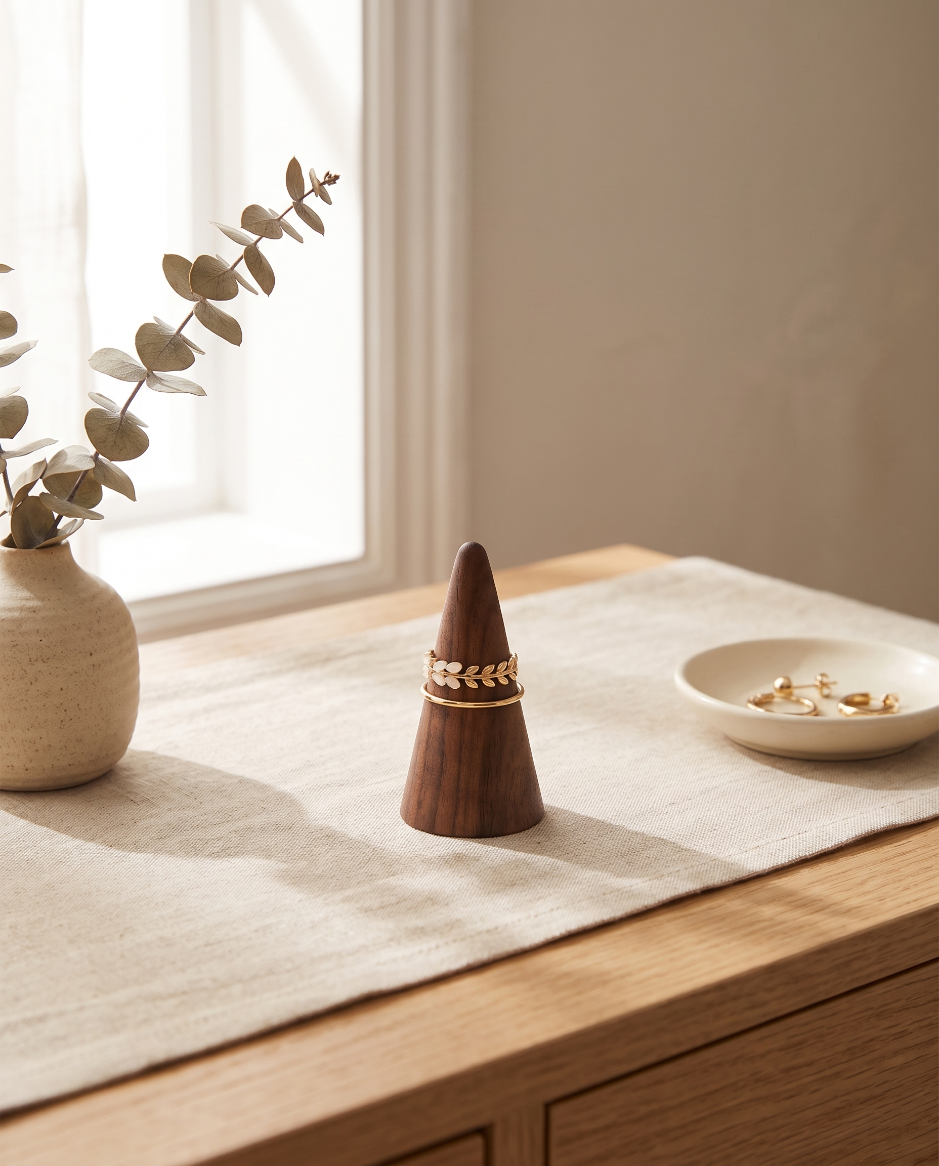 Walnut ring cone holder with one conical base and gold-tone statement ring