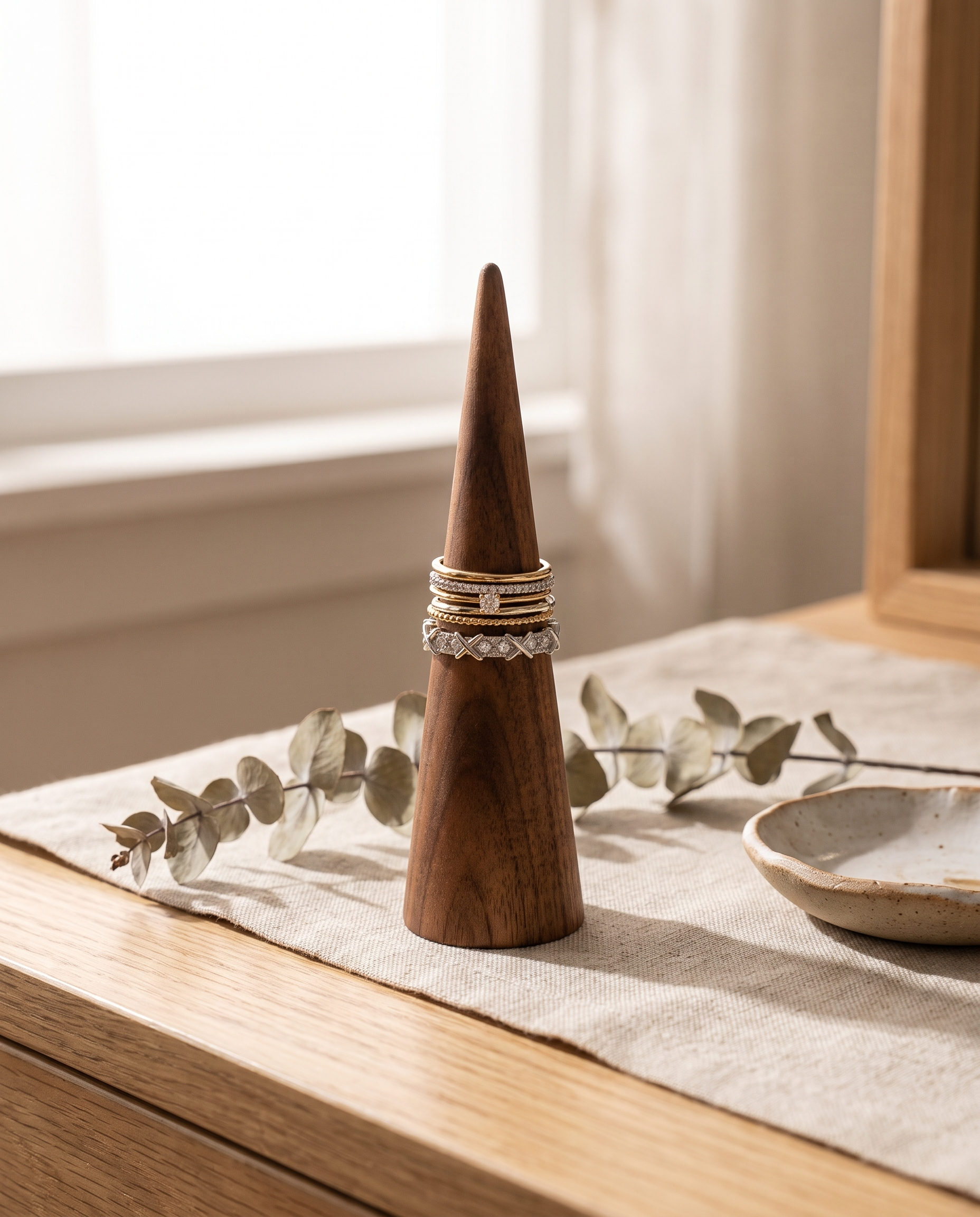 Walnut ring cone holder with one tall cone stand and stacked gold-tone rings