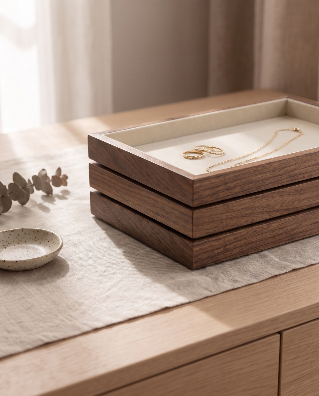 Three walnut jewelry trays stacked flush, about three inches tall in total
