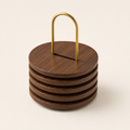 Stacked round walnut trivets with brass carry handle, set of six.
