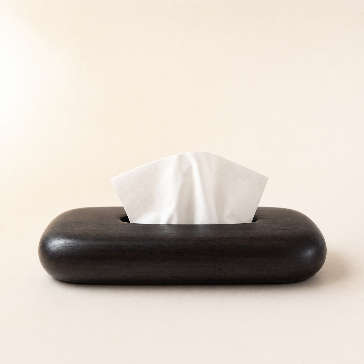 Ebony dark wood tissue box cover with white tissues protruding from top slot