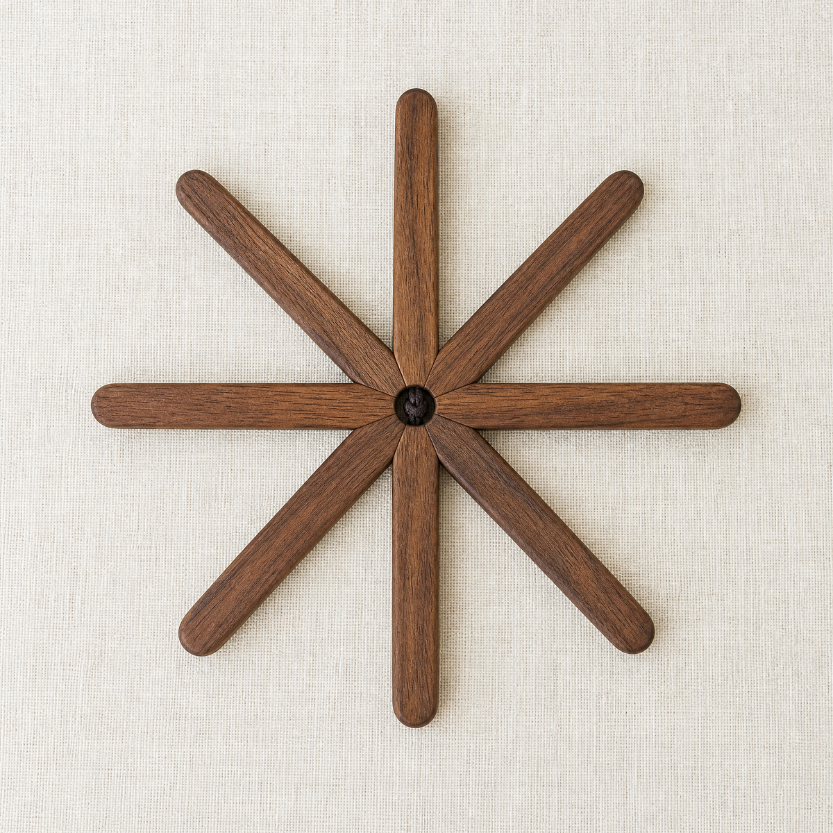 Walnut tree trivet with star-like branch arms and central round knob