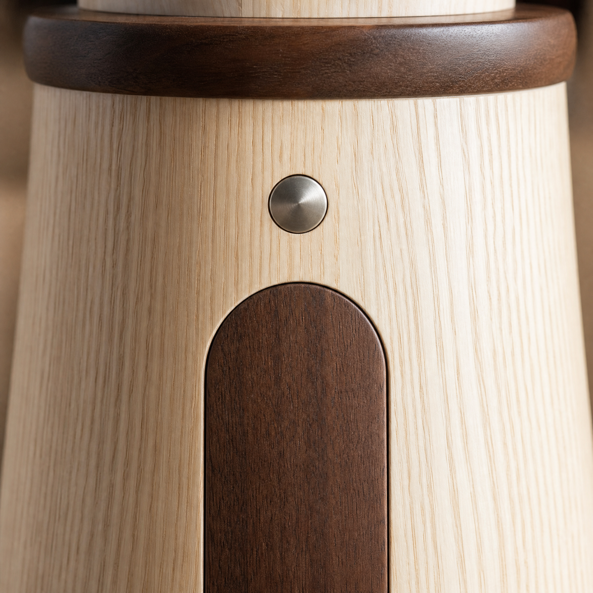 Close-up of wooden lighthouse night light touch button and dark arched front panel