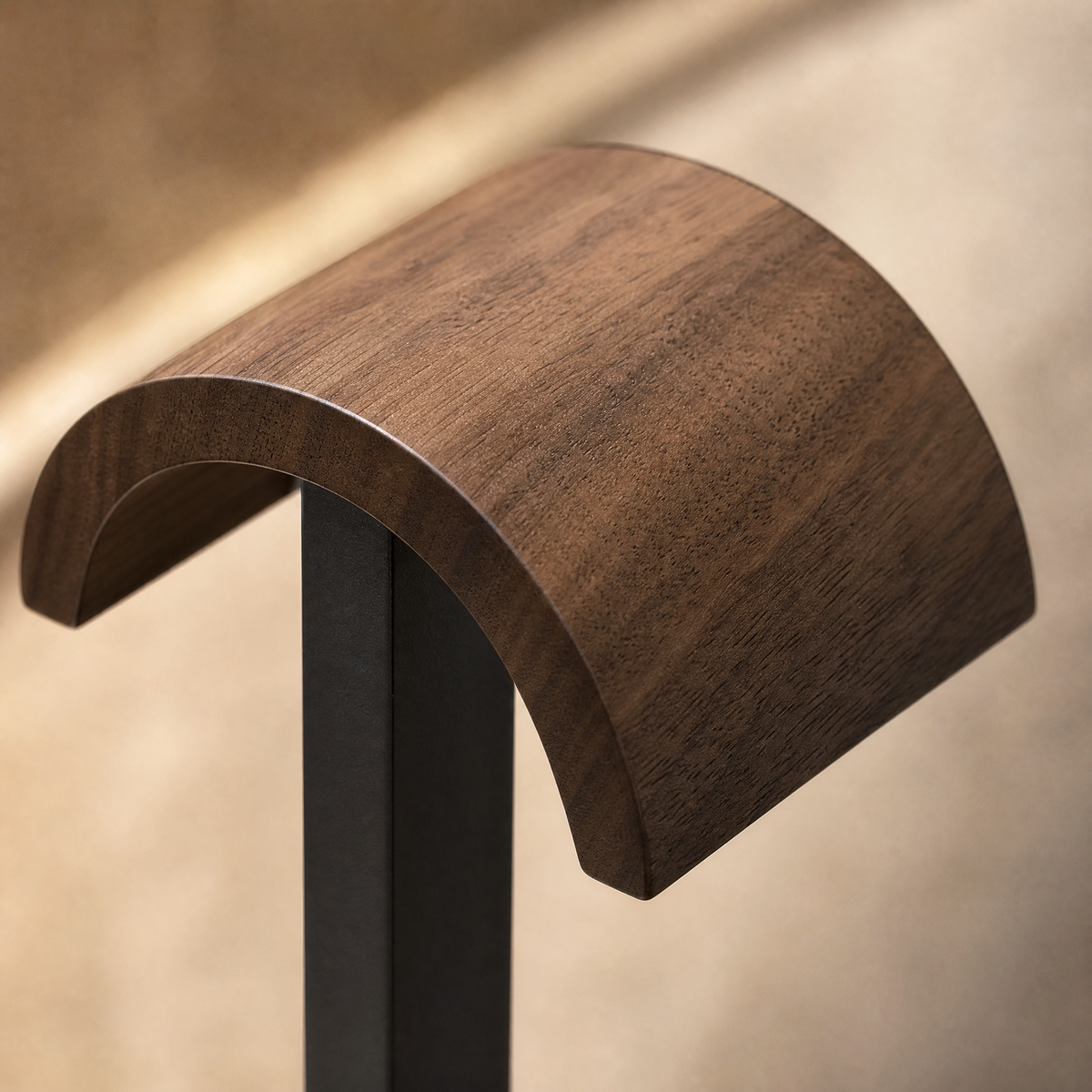 Walnut headphone rest with curved wooden grip on black steel support post