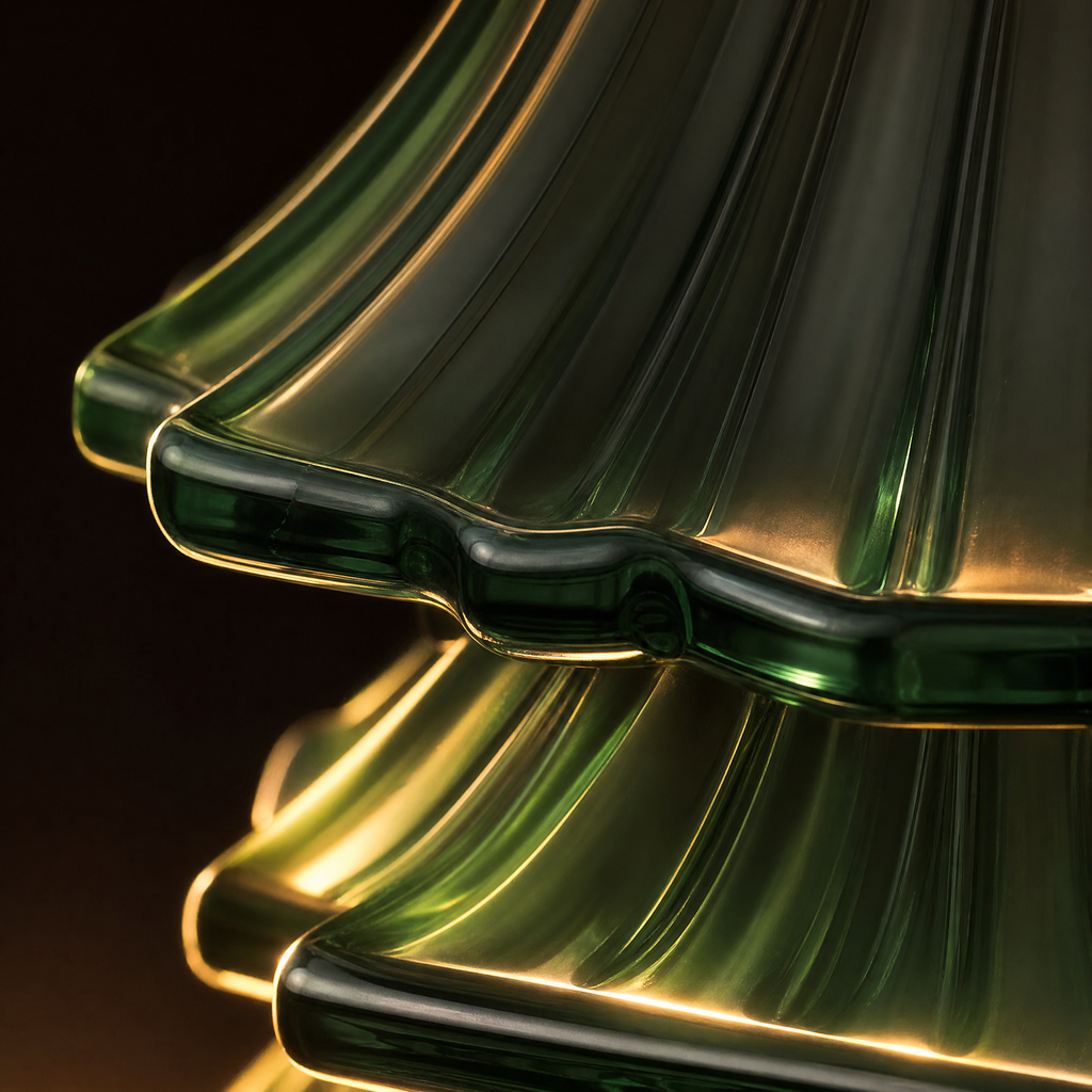 Close-up of green glass diffuser tree form with curved ripple details