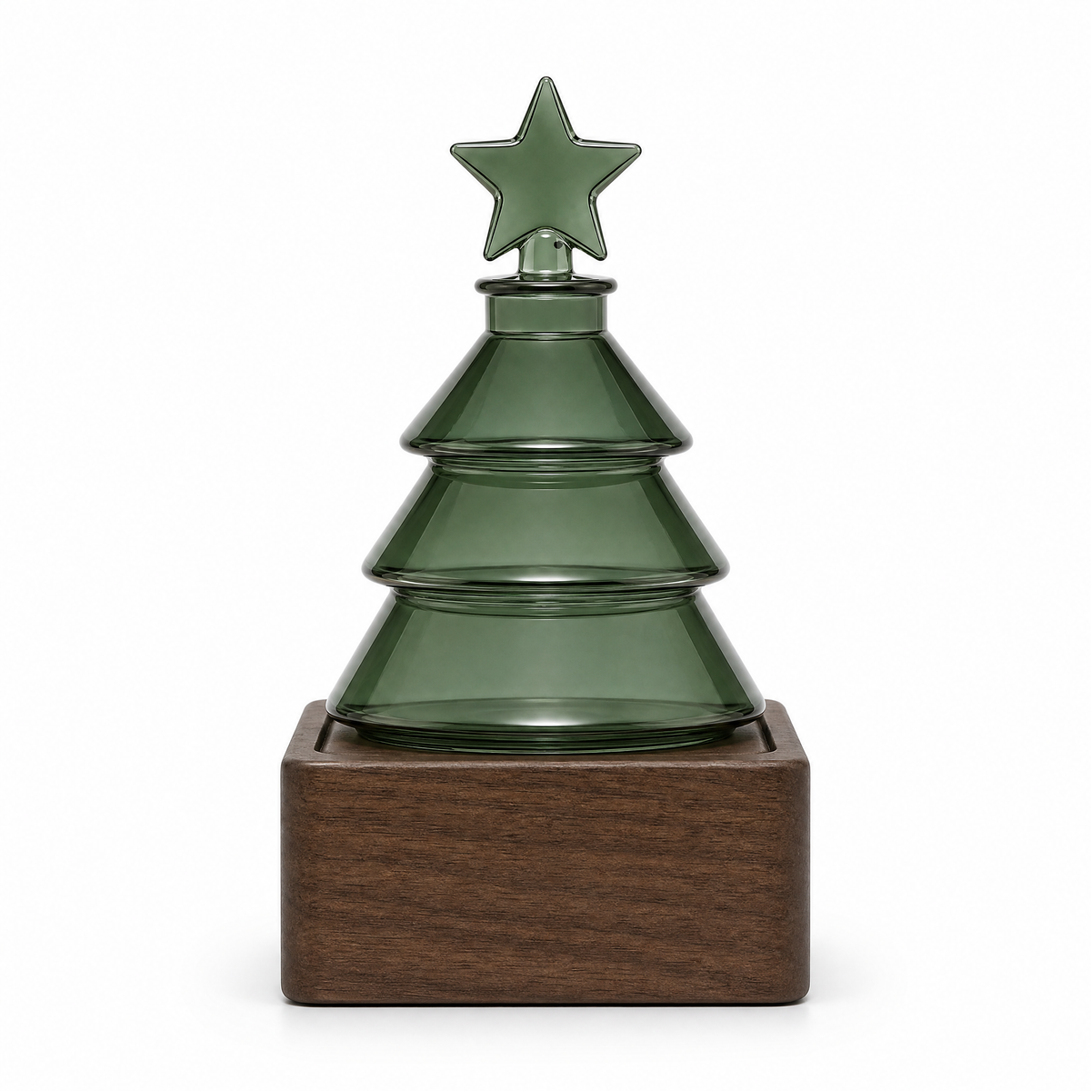 Green glass Christmas tree diffuser with star topper on walnut wood base