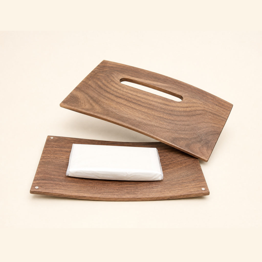 The two boards apart with a slim tissue pack on the base board, corner magnets visible