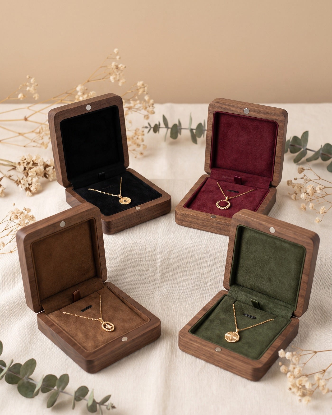 Walnut necklace gift boxes with open velvet compartments, holding pendant necklaces