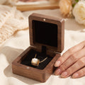 Walnut necklace display box with black velvet, open view holding gold chain ring